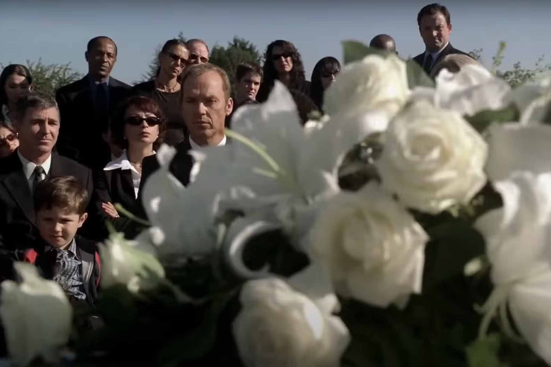 Jonathan Rivers (Michael Keaton) attends a funeral in White Noise (2005).